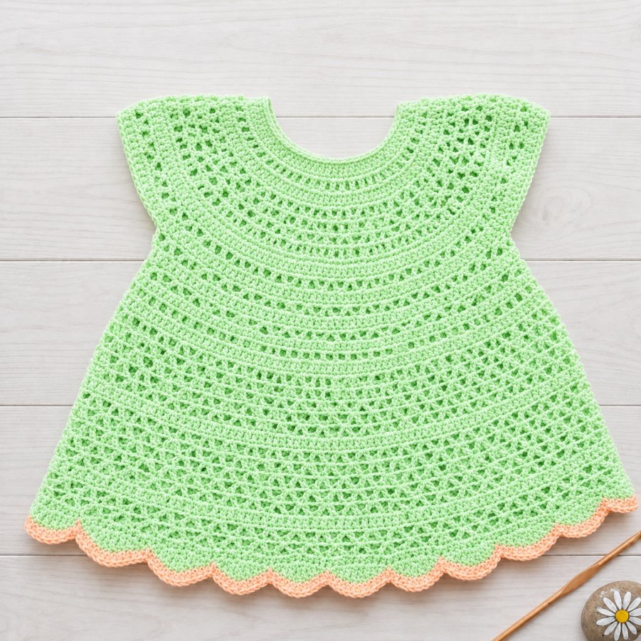 Mint green and peach lacy crochet baby frock with a scalloped hem